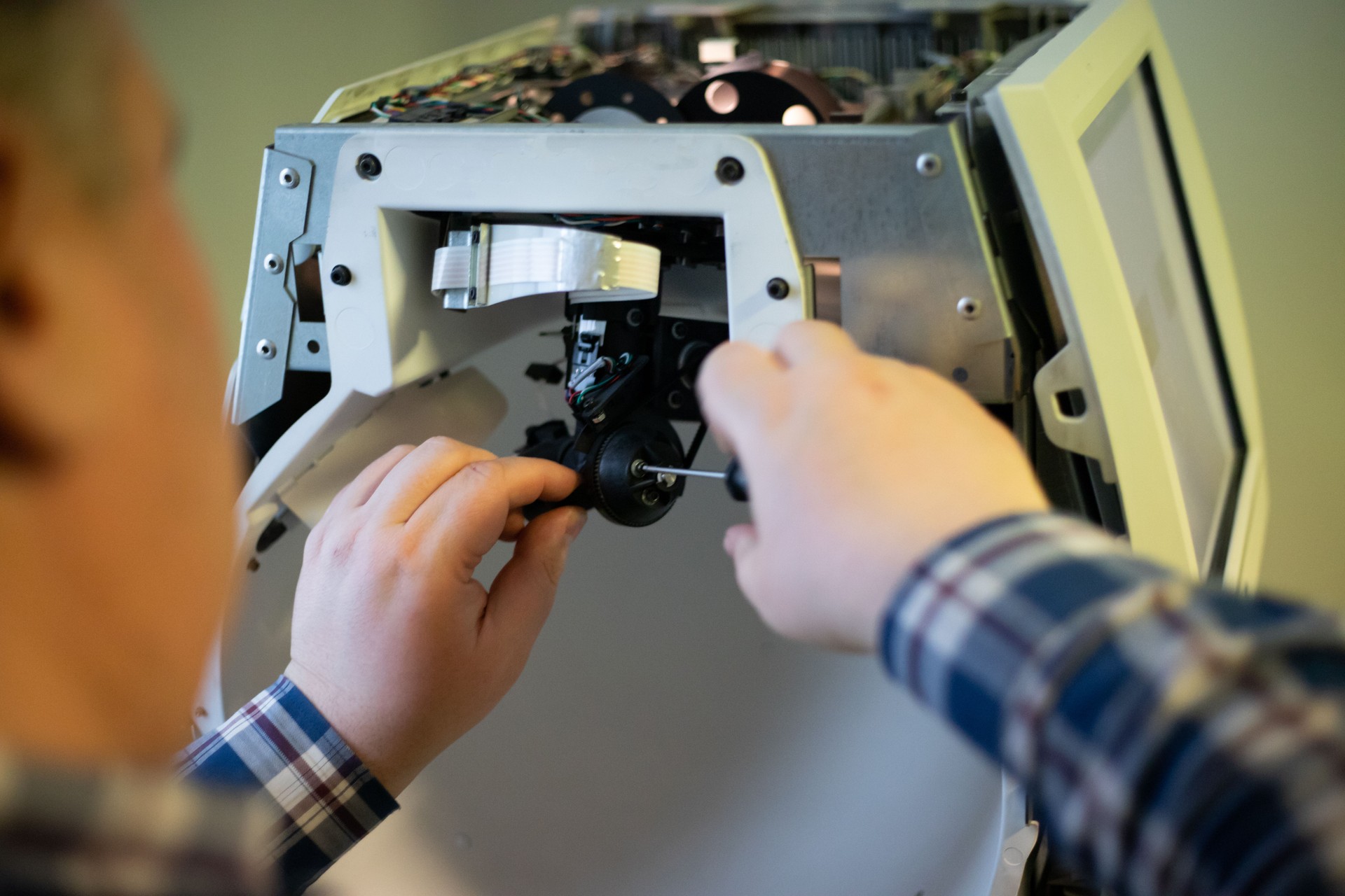 Technician Repairs Ophthalmic Device